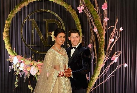 Newly married couple Priyanka Chopra and Nick Jonas during a photo op before their wedding reception in New Delhi on Tuesday. Express (Photo: Naveen Kumar)