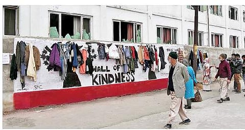 The poor and needy can take clothes and other items from the wall (Photo | Zahoor Punjabi)