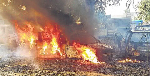Vehicles set on fire by the mob during a protest over the alleged illegal slaughter of a cow in Bulandshahr on Monday | PTI