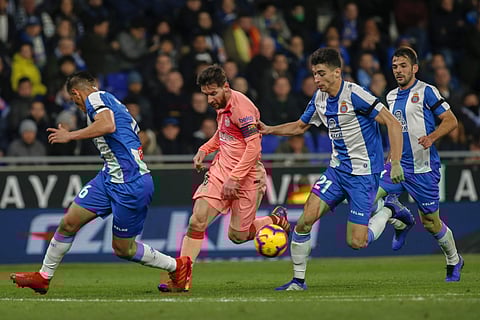 FC Barcelona's Lionel Messi, center, controls the ball during the Spanish La Liga soccer match between Espanyol and FC Barcelona at RCDE stadium in Cornella Llobregat, Spain, Saturday, Dec. 8, 2018. | AP