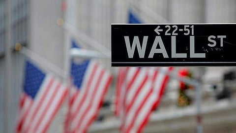 A street sign for Wall Street is seen outside the New York Stock Exchange (NYSE) in Manhattan, New York City. 