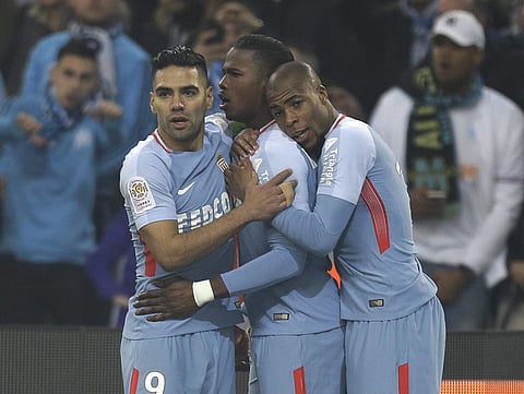 Monaco's Keita Balde, center, celebrates with Radamel Falcao, left, and Djibril Sidibe after scoring during the League One soccer match between Marseille and Monaco. | AP