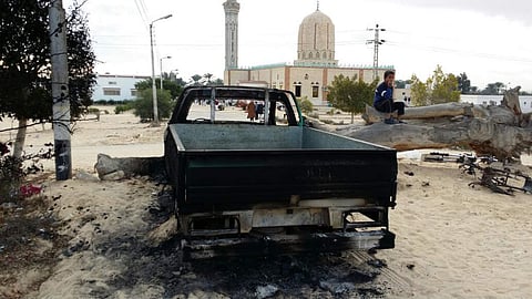 A burned truck is seen outside Al-Rawda Mosque in Bir al-Abd northern Sinai (File | AP)