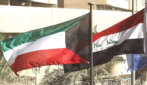 The flags of Kuwait and Iraq fly outside of a conference in Kuwait City | AP