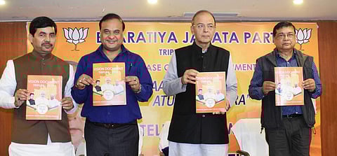 Senior BJP leader and Finance Minister Arun Jaitley along with party leaders Syed Shahnawaj and Himanta Biswa Sarma releases party's vision document for the Assembly polls in Agartala on Sunday | PTI