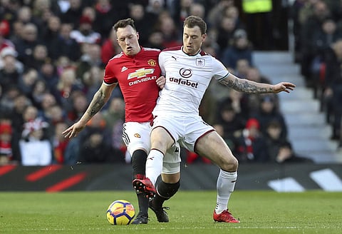 Manchester United's Phil Jones, left | AP