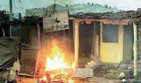 A file picture of a house that was torched during Adivasi-Lambada clash in Adilabad | Express