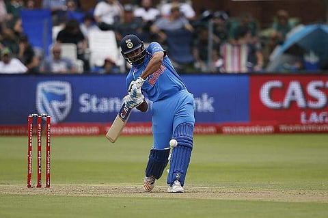 Rohit Sharma hits a four on a ball delivered by South Africa bowler Kagiso Rabada during the fifth One Day International cricket. | AFP