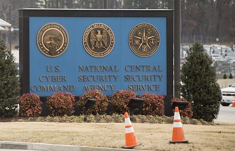 A sign for the National Security Agency (NSA), US Cyber Command and Central Security Service, is seen near the visitor's entrance to the headquarters of the National Security Agency. | AFP