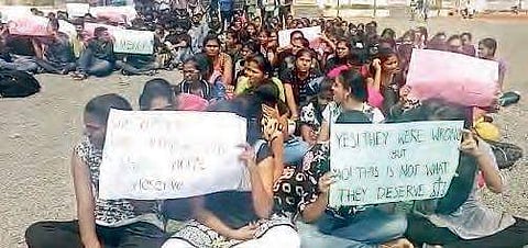 Students staging a dharna on the NIT campus at Peda Tadepalli village in Tadepalligudem mandal on Tuesday | Express