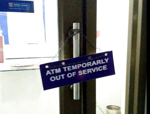 Bank ATMs sport ‘temporarily-out-of-service’ boards in Visakhapatnam on Tuesday. | Express Photo Services