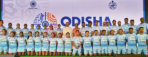 Odisha CM Naveen Patnaik poses for a photograph with the Indian hockey team players at a press conference in New Delhi on Thursday. (PTI)