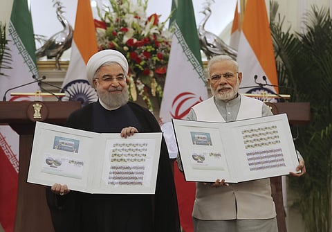 Indian Prime Minister Narendra Modi, right, with Iranian President Hassan Rouhani release a postal stamp commemorating growing economic and trade ties between the two nations | AP