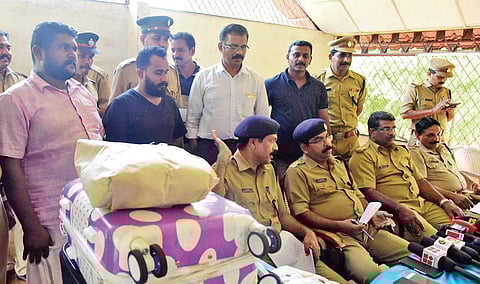 The Excise Enforcement Squad with the  arrested persons at a press meet in Aluva on Saturday | Albin Mathew