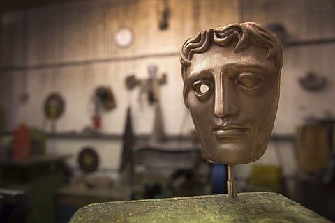 With Hollywood still reeling from the fallout of the Harvey Weinstein scandal, the resulting anti-sexual harassment campaigns were reflected in the mood of the evening at the BAFTA 2018 Awards in London. (IN PIC: A bronze alloy BAFTA mask stands in a foundry in West Drayton, London, ahead of the award ceremony in February.) (Photo | AP)