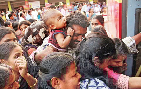 Commuters struggle to get onto a KSRTC bus in Kochi on Monday as the private bus strike entered the fourth day | k shijith
