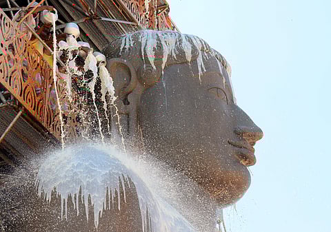The monolithic statue of Jain God Bahubali or Gomateshwara is located on the Vidyagiri hills at the Jain pilgrimage site of Shravanabelagola near Karnataka Bangalore. In Pic: Devotees pour milk on Gomateshwara during the anointment at Shravanabelagola. | (Pushkar V | EPS)