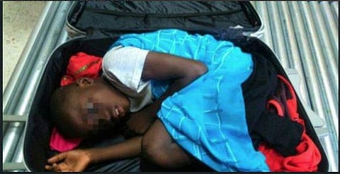 The heart-rending photo of the boy inside the suitcase went round the world in 2015 (Twitter photo)