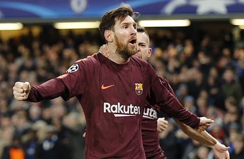 Barcelona's Lionel Messi celebrates scoring his side's first goal during a Champions League round of sixteen first leg soccer match between FC Barcelona and Chelsea at Stamford Bridge stadium in London, Tuesday, Feb. 20, 2018.  | AP