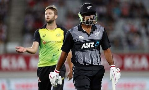 New Zealand's Ish Sodhi (R) walks off after being dismissed by Australia's Andrew Tye (L) during the final Twenty20 Tri Series international cricket match between New Zealand and Australia at Eden Park in Auckland on February 21, 2018.  | AFP