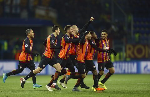 Shakhtar Donetsk's Fred celebrates with his teammates after scoring his side's second goal during the Champions League, round of 16, first-leg soccer match against Roma. | AP
