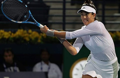Garbine Muguruza of Spain returns the ball to Caroline Garcia of France during their quarter-final tennis match at the WTA Dubai Duty Free Tennis Championship. | AFP