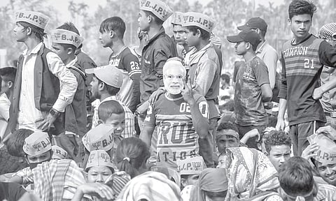 A BJP supporter sports a Narendra Modi mask during a campaign rally of the Prime Minister at Kohima in Nagaland on Thursday. | PTI