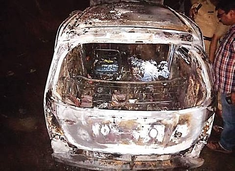 Charred remains of the car | Express