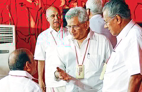 CPM general secretary Sitaram Yechury speaks to state secretary Kodiyeri Balakrishnan as senior leader Elamaram Kareem, left, and Chief Minister Pinarayi Vijayan look on | Ramees M A