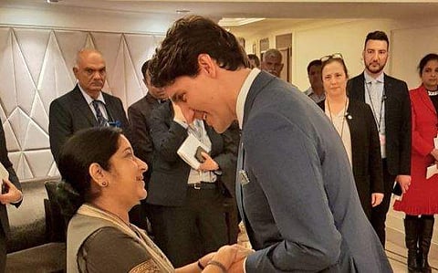 Sushma Swaraj with Canadian PM Justin Trudeau (Twitter | Raveesh Kumar)