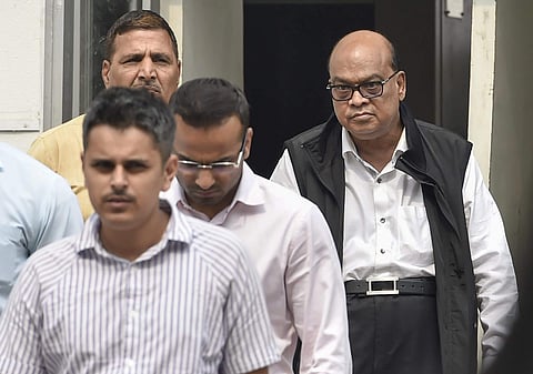 Rotomac Pens owner Vikram Kothari and his son Rahul Kothari escorted by CBI officials. (Photo | PTI)