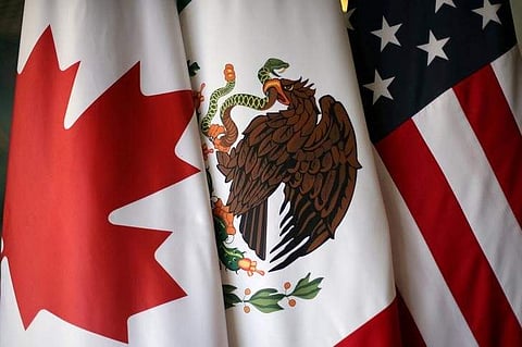Flags are pictured during the fifth round of NAFTA talks involving the United States, Mexico and Canada, in Mexico City, Mexico, November 19, 2017. (Reuters)