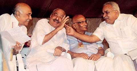 CPI secretary Kanam Rajendran makes a point with KC(M) supremo K M Mani during the CPM state conference at Thrissur on Friday as CPM leader Elamaram Kareem (extreme left) and CPM politburo member S Ramachandran Pillai look on | RAMEES M A