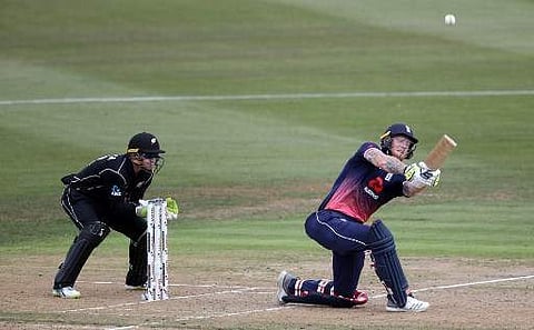 England's Ben Stokes (R) bats as New Zealand's Tom Latham (L) looks on during the first one-day international (ODI) cricket match between New Zealand and England at Seddon Park in Hamilton on February 25, 2018. | AFP