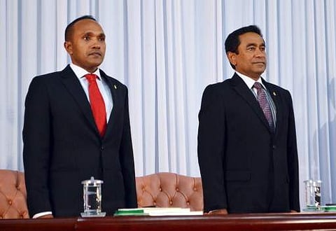 Maldivian President Abdulla Yameen (R) and the former Vice-President Mohamed Jameel Ahmed (L) stand at attention during their swearing in ceremony in Male on November 17, 2013. | AFP File Photo