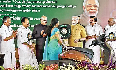 Prime Minister Narendra Modi launches the Amma Two-Wheeler Scheme in the presence of Tamil Nadu Governor Banwarilal Purohit (centre) and Chief Minister Edappadi K Palaniswami in Chennai on Saturday | P Jawahar