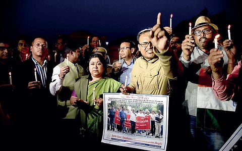 Bureaucrats take out a candlelight rally in the city to protest the alleged attack on Delhi Chief Secretary Anshu Prakash in New Delhi  | Parveen negi