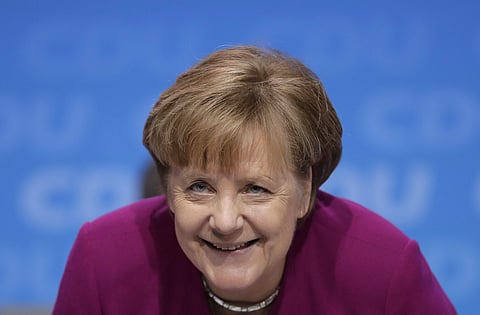German Chancellor and party chairwoman Angela Merkel smiles at the party convention of the Christian Democratic Union CDU in Berlin | AP