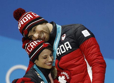Bronze medalists in the pairs free skate figure skating Meagan Duhamel and Eric Radford of Canada (File | AP)
