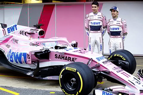 Force India drivers Sergio Perez of Mexico, right, and Esteban Ocon of France pose for photos during the Force India team official presentation at the Catalunya racetrack in Montmelo, outside Barcelona, Spain, Monday, Feb. 26, 2018. | AP