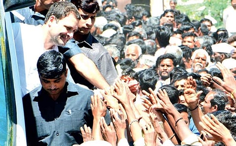 Congress president Rahul Gandhi  greets supporters in Godchi village in Belagavi district on Monday | D Hemanth