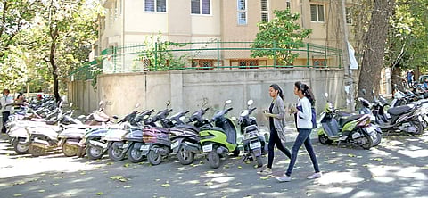Students of Mount Carmel College park their vehicles by roadside on Palace Loop Road Nagaraja Gadekal