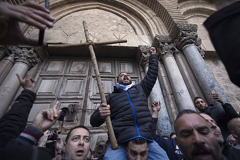 Demonstrators protest outside the closed doors of the Church of the Holy Sepulchre, Jerusalem | AP