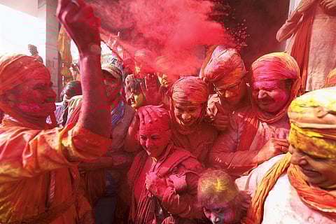 Holi falls on March 1 and 2 this year and the pre-holi celebrations have already taken over the people in Mathura and Vrindavan. Devotees of Lord Krishna celebrate this festival of colours with fervent and enthusiasm. IN PIC: Mathura people play with 'gulal' during Holi celebrations at a village in Nandgaon, Uttar Pradesh on Sunday. (Photo: PTI)