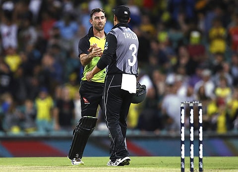 Australia's Glenn Maxwell, left, shakes hands with New Zealand's Ross Taylor following Australia's win in their Twenty/20 cricket match in Sydney, Saturday, Feb. 3, 2018. | AP