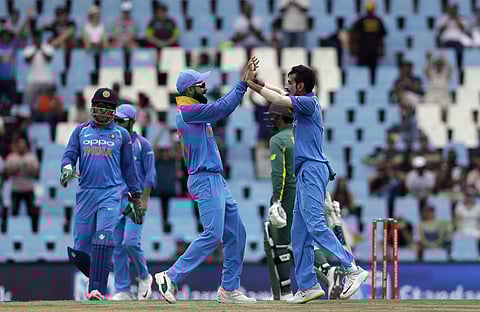 Yuzvendra Chahal celebrates with captain Virat Kohli after dismissing South African batsman (Photo | AP)