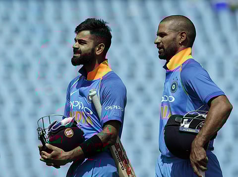 Virat Kohli with teammate Shikhar Dhawan leave the field after winning the second One Day International cricket. (Photo | AP)