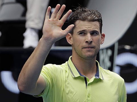 Austria's Dominic Thiem waves after defeating France's Adrian Mannarino during their third round match at the Australian Open tennis championships in Melbourne, Australia, Saturday, Jan. 20, 2018. | AP