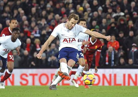 Tottenham's Harry Kane scores his side's second goal during the English Premier League soccer match between Liverpool and Tottenham Hotspur at Anfield in Liverpool. | Photo: AP