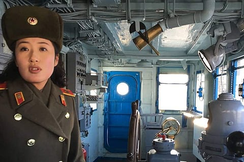 In this Wednesday, Jan. 24, 2018, photo, a North Korean military guide leads a tour of the USS Pueblo in Pyongyang, North Korea. (AP)